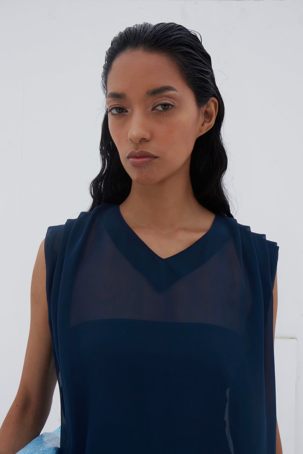Yaku blouse back view showing round collar and asymmetric hem