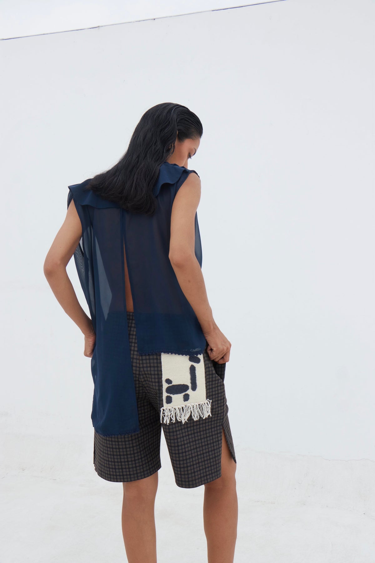 Navy sheer Yaku blouse detail showing hand-finished border
